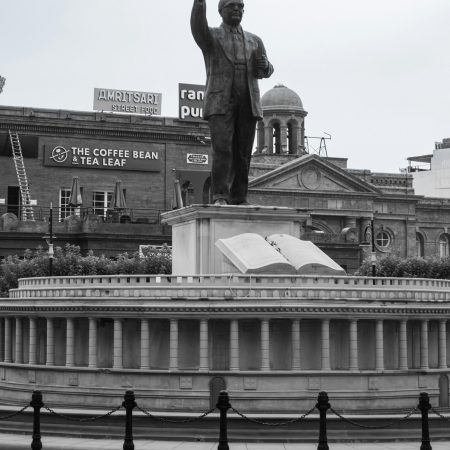 A monochrome image of a historical statue in Amritsar, Punjab, highlighting cultural heritage.